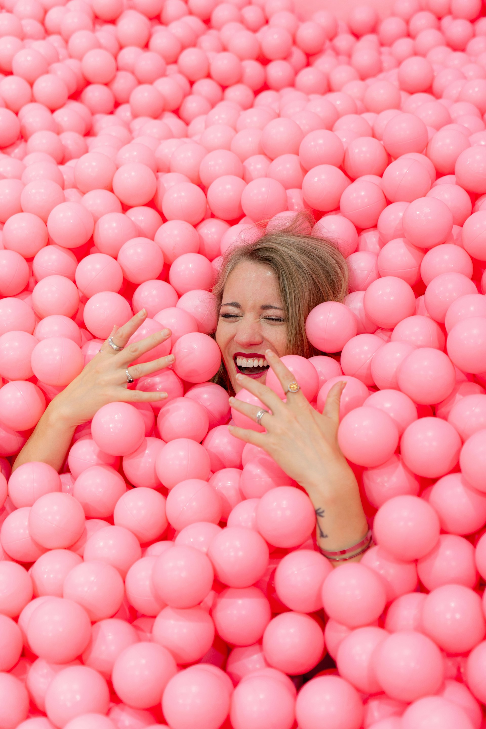 Woman in pink ball pit